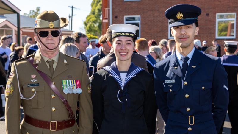 Recruit Amber Barlass, centre, stands together with her father, Warrant Officer Class One Vincent Barlass, and brother Leading Aircraftman Rhys Barlass at the Royal Australian Navy Recruit School in Victoria.