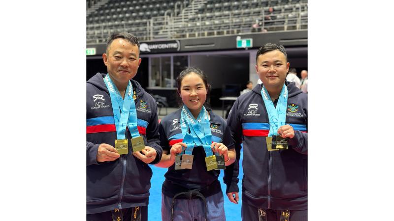 Chaplain Dennis Park (left), Flight Lieutenant Leah Park (centre) and Musician Robin Park with their medals at the New South Wales State Taekwondo Championships.