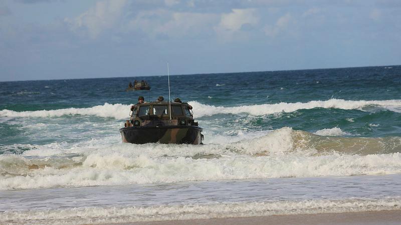 Australian Army soldiers from the 10th Force Support Battalion returning to the shore of Rainbow Beach in a Lighter Amphibious Resupply Cargo 5 Tonne (LARC V).