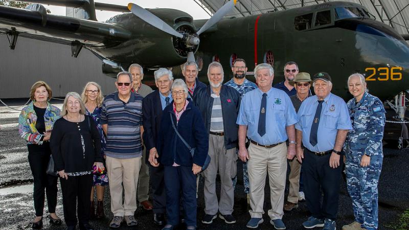 Retired Caribou aviators and 35 Squadron Association members with a restored de Havilland DHC-4 Caribou at the RAAF Amberley Aviation Heritage Centre.