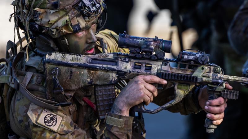 An Australian Army soldier from Battle Group Heeler conducts a clearance of the Urban Operational Training Facility at Shoalwater Bay Training Area during Exercise Diamond Run 2024.
