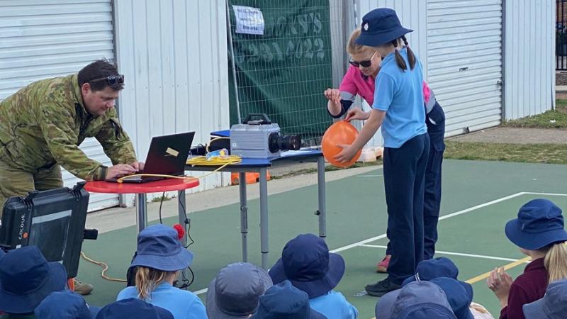 Members of the Joint Explosives Ordnance Support and Joint Proof and Experimental Unit participate in a school visit in Canberra to showcase their unique STEM careers.