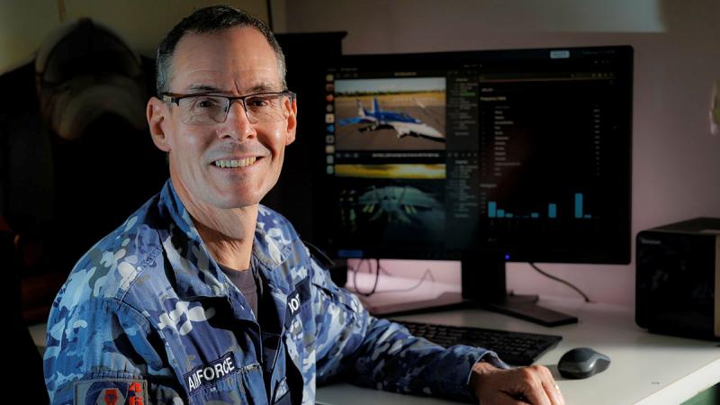 Air Force Imagery Specialist, Flight Sergeant Michael Bott searches for aircraft using an algorithim that he has helped produced while involved in the Edgy-Air Force program.