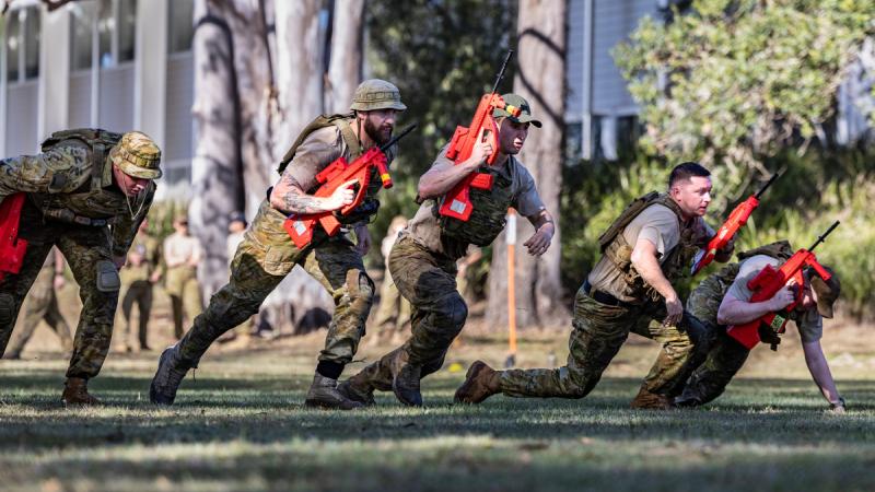 Personnel from 2 Security Forces Squadron participate in a in a simulated section attack during the Combat Fit day at RAAF Base Amberley. 