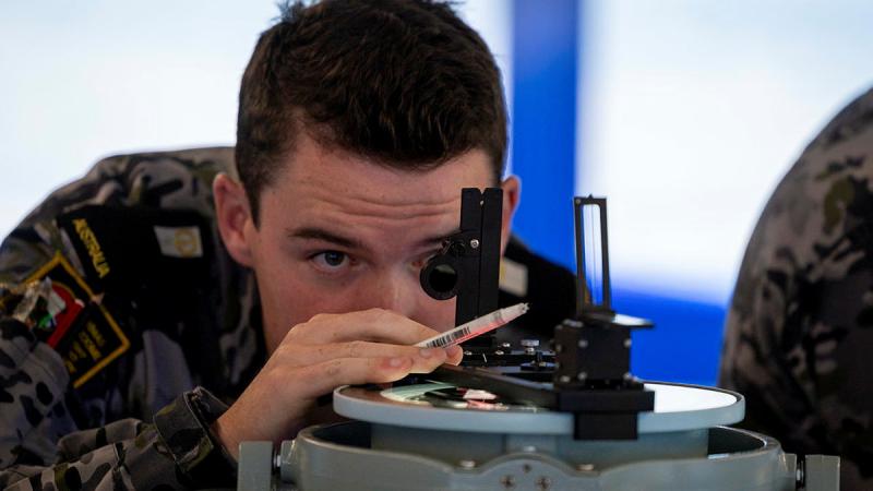 Midshipman Xavier Ryan takes a bearing fix in one of the new bridge simulators located at Defence Establishment Berrimah, Darwin.
