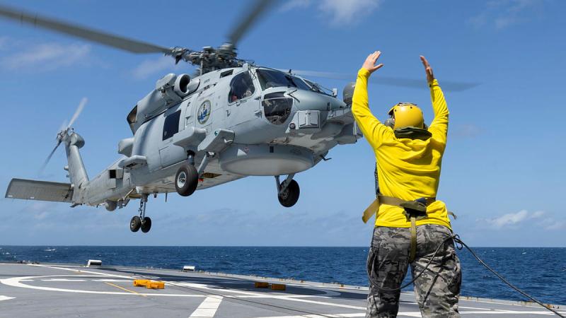 Leading Seaman Aviation Technician Airframe Prudence Harper from 808 Squadron conducts a flying exercise with HMAS Perth’s MH-60R Aircraft “Siren” during a regional presence deployment. 