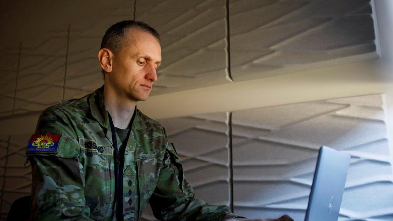 Captain Scott Hosking performs his role as an Army data cataloguer.
