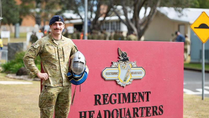 Signaller Ellis Williams outside 7th Signal Regiment at Borneo Barracks, Queensland with his Buhurt helmet.