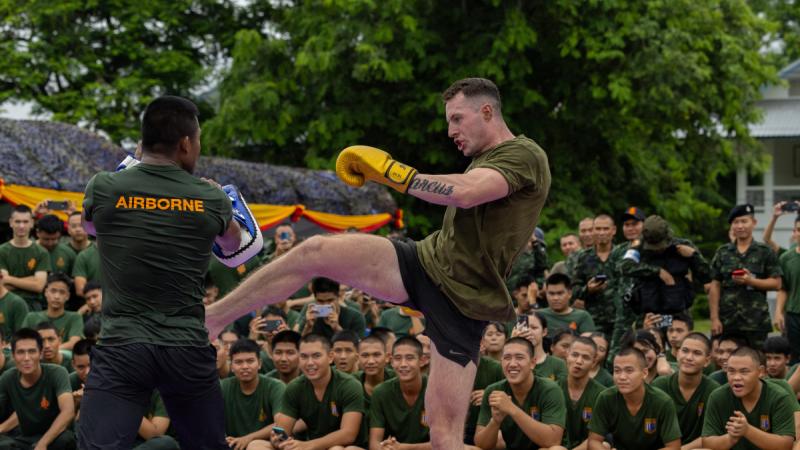 Australian Army officer Lieutenant Felix Jenney from Rifle Company Butterworth Rotation 144 spars with champion Muay Thai fighter Sombat “Buakaw” Banchamek on Exercise Chapel Gold 2024 in Chiang Rai, Thailand.