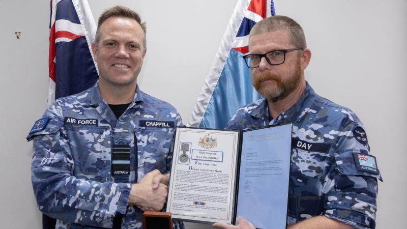 Flight Sergeant Barry Day from Heavy Air Lift Systems Program Office is presented his fifth clasp to his long service medal by the Chief of Air Force Air Marshal Stephen Chappell.