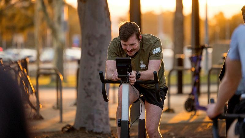 A 460 Squadron aviator pedals for charity as the sun rises at Canberra.