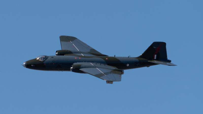  100 Squadron English Electric Canberra bomber TT heritage aircraft flies over the Amberley Aviation Heritage Centre in Queensland.