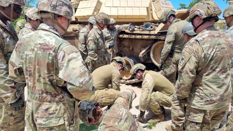 Australian sappers from 3rd Combat Engineer Regiment and the School of Armour learn maintenance and operation of the armoured breaching vehicle during the Combat Engineer Heavy Track Course in Missouri.