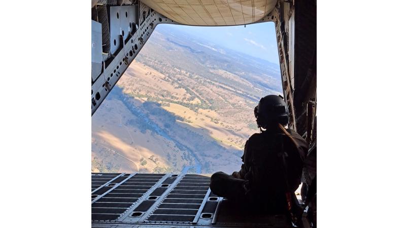 Air Force C-27J Spartan Loadmaster Corporal Deniele Oehm enjoys the view on the ramp of a C-27J Spartan during a flight.