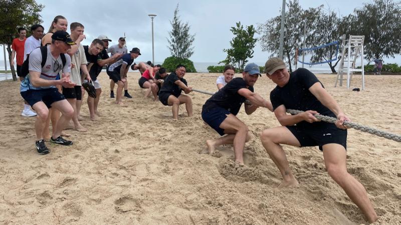 The HMAS Canberra team wrestle for victory in tug of war during a recent sports carnival on the Cairns Esplanade.