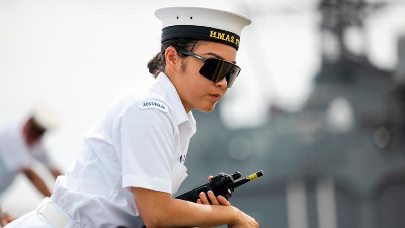Able Seaman Boatswain’s Mate Anna Kuroda monitors the ship as HMAS Sydney berths alongside Yokosuka, Japan during a regional presence deployment.