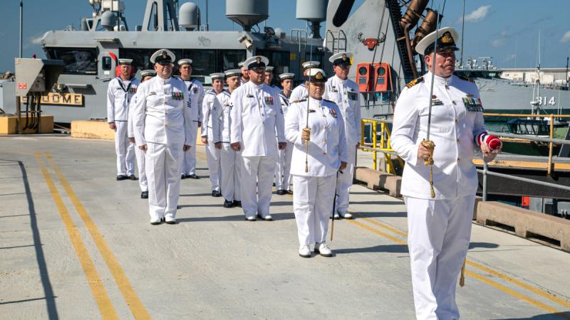 Members of ship's company of HMAS Broome prepare to march past during the vessel's decommissioning ceremony at HMAS Coonawarra, Darwin.