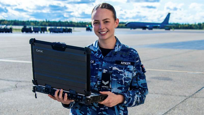 Corporal Jess Aitken of 1 Combat Communications Squadron sets up vital ICT infrastructure during Exercise Red Flag Alaska, ensuring secure communications for Air Force. 