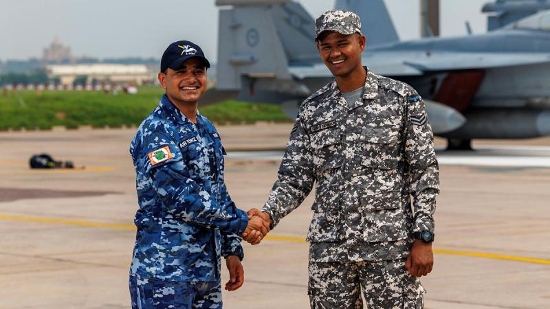 Royal Australian Air Force Leading Aircraftman Parveen Panwar and Indian Air Force Corporal Akash Bhandari meet on the flightline in Jodhpur, India. 
