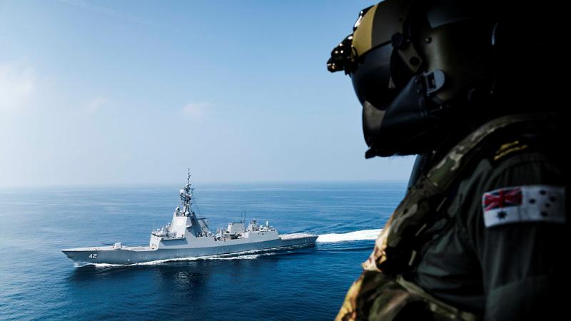Leading Seaman James Neville looks out towards HMAS Sydney as the ship is deployed on Operation Argos. 