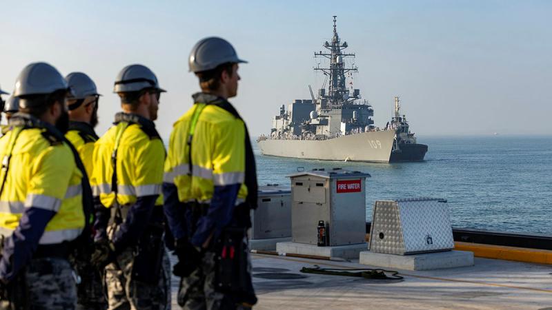 Royal Australian Navy Port Services workers prepare to berth Japanese Destroyer, JS Ariake in Darwin Harbour as part of Exercise Kakadu 24. 