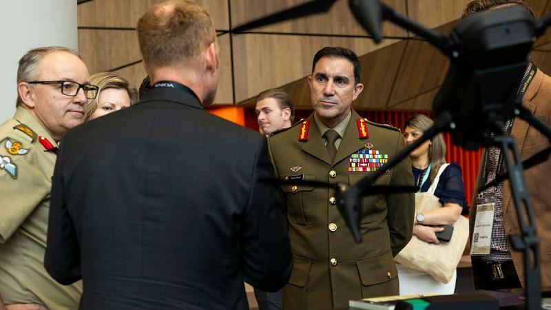 Chief of Army Lieutenant General Simon Stuart engages with industry exhibitors at the Army Innovation Day as part of the Chief of Army Symposium 2024 at the Melbourne Convention and Exhibition Centre, Victoria. 