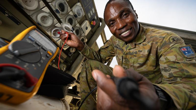 6th Engineering Support Regiment electronics technician Lance Corporal Neto Ikponmwosa Ogbonmwan conducts fault finding on a diesel generator during Operation Render Safe in the Solomon Islands. 
