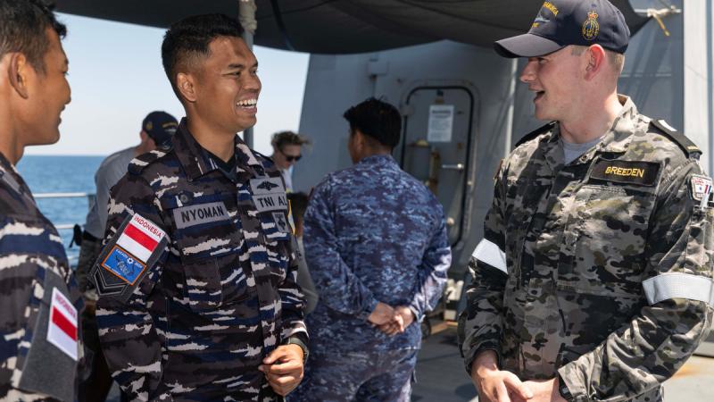 Indonesian Military Police Sergeant Joni Nyoman with Midshipman Joshua Breedon on the upper deck of HMAS Warramunga during Exercise Kakadu 24. 