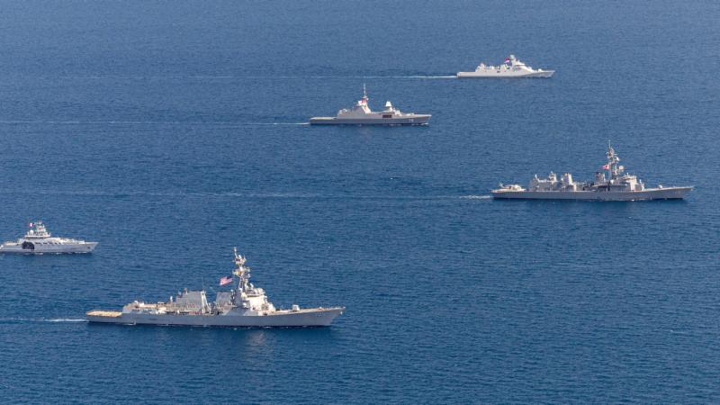 Navy ships conduct a multilateral cooperative activity during Exercise Kakadu 2024 off the coast of Darwin, Northern Territory.