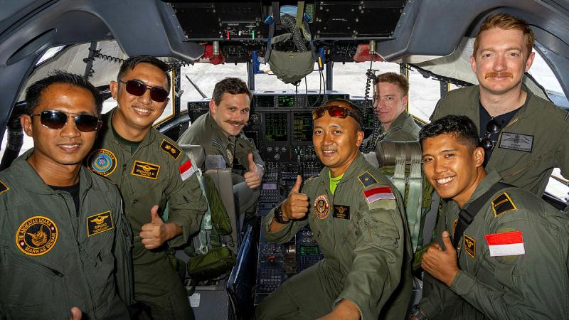Australian 37 Squadron pilot, Flight Lieutenant Jack Woodrow (right), conducts a familiarisation flight with aircrew from the Indonesian Air Force's 31st Air Squadron during Exercise Rajawali AUSINDO in Yogyakarta, Indonesia.