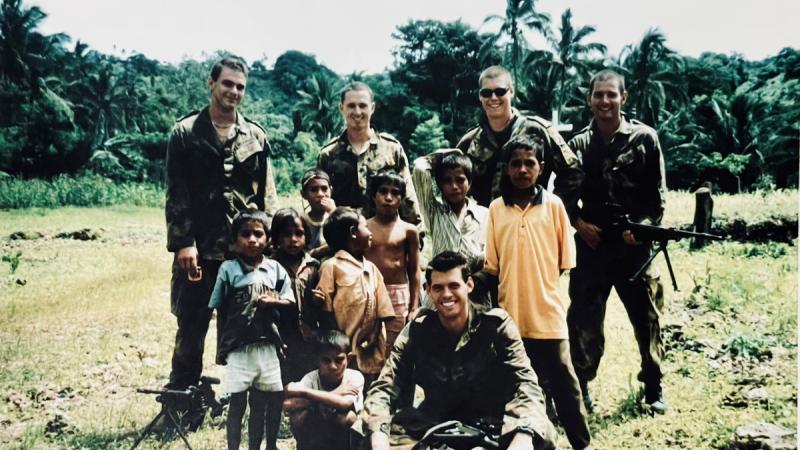Then-Flying Officer Harvey Reynolds, second from left, during his INTERFET deployment with 2 Airfield Defence Squadron on a routine patrol of Atauro Island, East Timor.