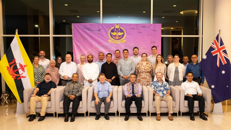 Australian High Commissioner to Brunei Darussalam Luke Arnold, centre, and members from the ADF and Royal Brunei Armed Forces gather at a farewell dinner in Brunei.