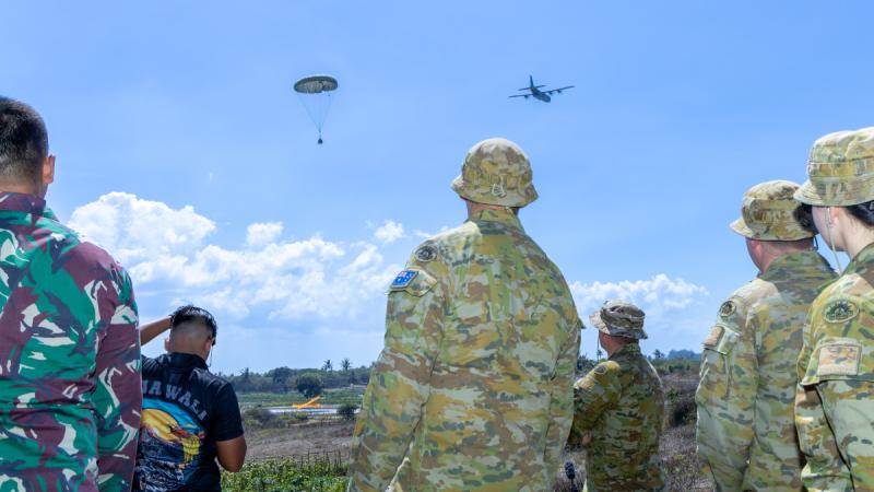 An Air Force C-130J Hercules drops a container delivery system during Exercise Rajawali Ausindo 24 in Ambal Training Area, Indonesia.