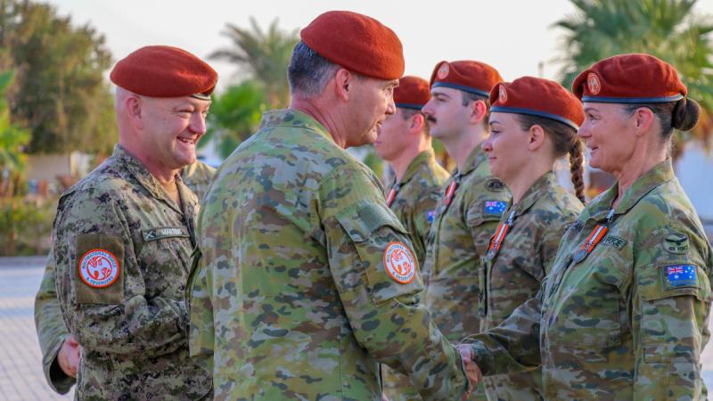 Sergeant Vicky Stanford is presented with the Multinational Force and Observers medal by Force Commander Multinational Force and Observers, Major General Michael Garraway during a ceremony at the Sinai Peninsula in Egypt.