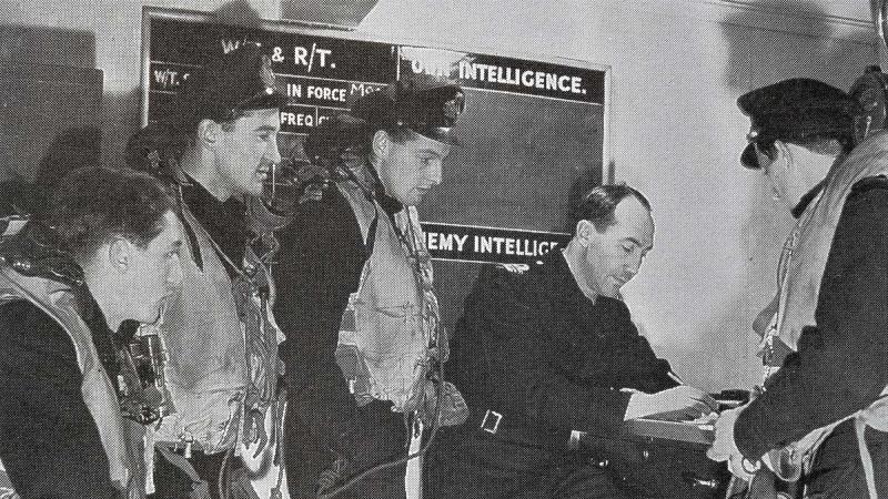 Admiral Victor Smith, seated, as air operations officer on board HMS Tracker operating in the Atlantic and Arctic in 1943.