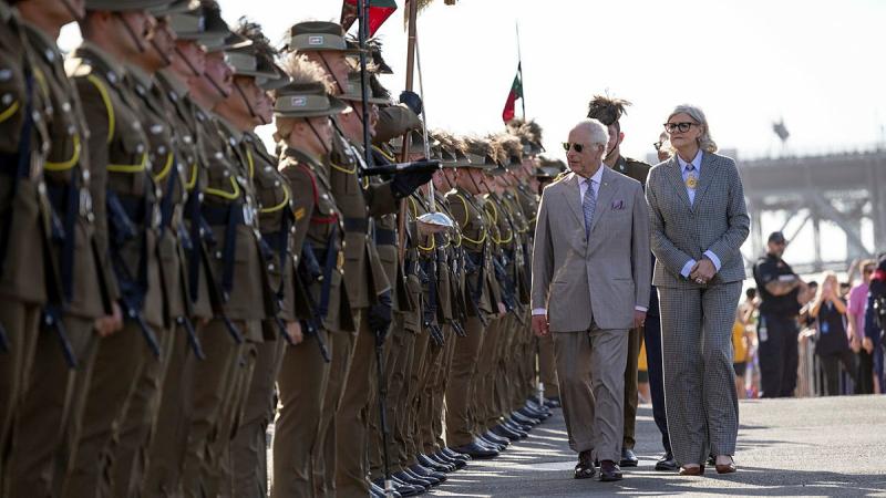 King Charles inspects members of the 1st Armoured Regiment at the Man O'War Steps in Sydney. 