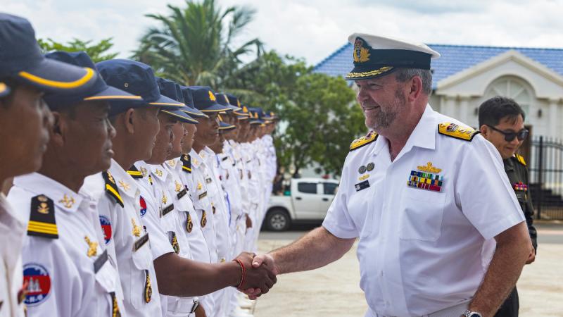 Commander IPE24 Commodore Michael Harris greets officials from the Royal Cambodian Armed Forces at the Ream Naval Base during HMAS Perth's visit to Sihanoukville, Cambodia.