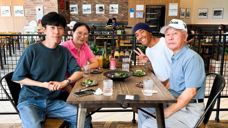 Able Seaman Brenton Manuel, back right, meets his grandparents for the first time as HMAS Sydney is berthed alongside Busan, Republic of Korea, during a regional presence deployment.