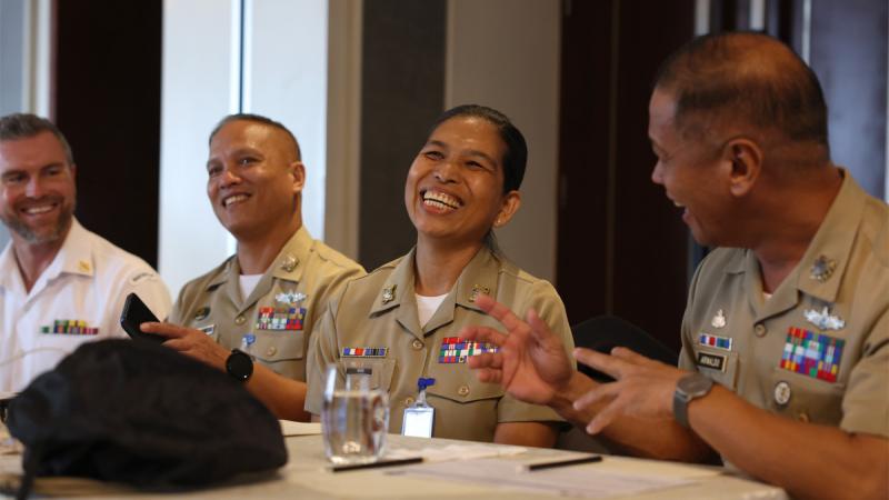 Philippine Navy Chief Petty Officer Zenel Goc shares a laugh with her counterparts during the ADF – Armed Forces of the Philippines senior enlisted leaders forum in Manila.