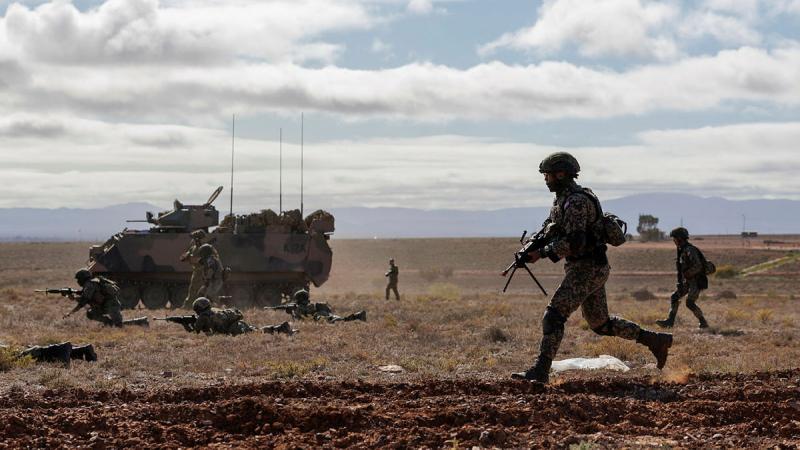 Australian Army and Malaysian Army soldiers conduct dry fire rehearsals during Exercise Southern Tiger at Cultana Field Training Area, South Australia. 