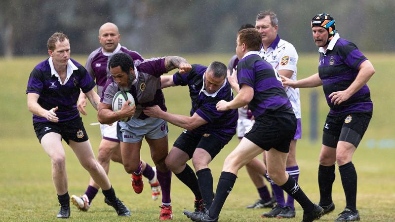 HQJOC’s Fifita Kolopeaua tries to break through the Australian War College defence during the Ash Power Cup. Photo: Corporal Luke Bellman