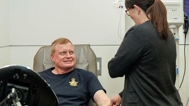 :  Newly appointed Air Force Blood Challenge Ambassador, WOFF-AF Ralph Clifton rolls up his sleeve to donate blood. 