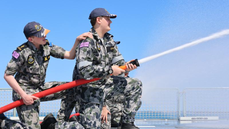 Australian Navy Cadets operate a firehose during the ANC National Annual Continuous Training camp at HMAS Cerberus.
