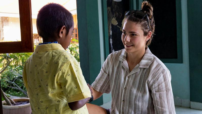 Private Rosie Mlikota speaks with a child at the Santa Clara Orphanage in Dili, Timor-Leste, during Indo-Pacific Endeavour. 