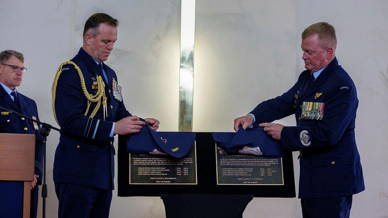 Chief of Air Force Air Marshal Stephen Chappell and Warrant Officer – Air Force Warrant Officer Ralph Clifton unveil the plaques commemorating the loss of 100 Squadron members who perished while serving on Beauforts A9-186 and A9-374 in 1943, at RAAF Base Point Cook. 