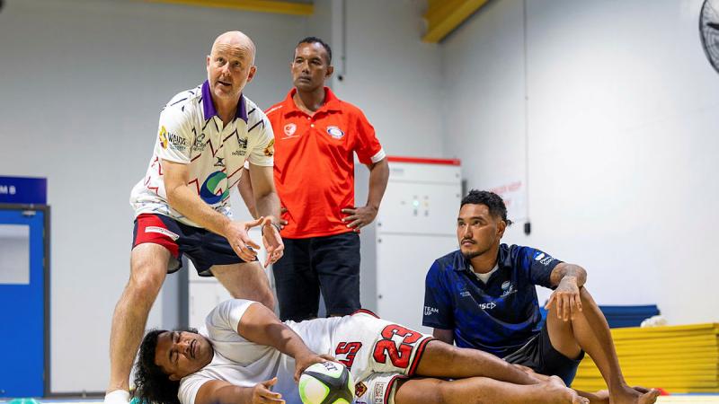 Royal Australian Navy Captain Nicholas Stoker coaches participants during the ADF Sports training program at the Solomon Islands National Institute of Sport in Honiara.