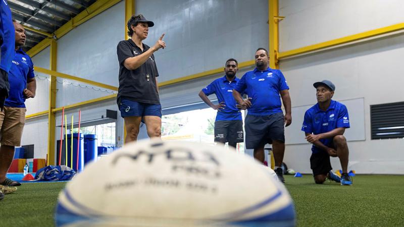 Captain Chloe Dray coaches participants during an ADF Sports training program at the Solomon Islands National Institute of Sport, Honiara. 