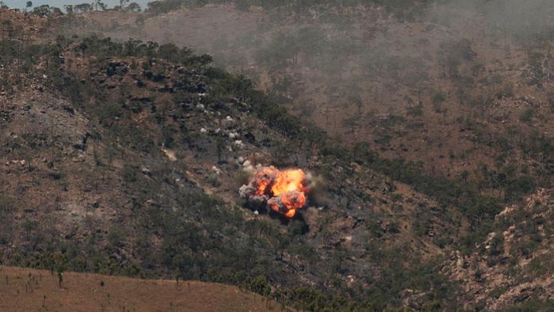 An F/A-18F Super Hornet aircraft drops a bomb at the Townsville Field Training Area as part of the Joint Terminal Attack Controller course live fire serials during Exercise Black Dagger 2024. 