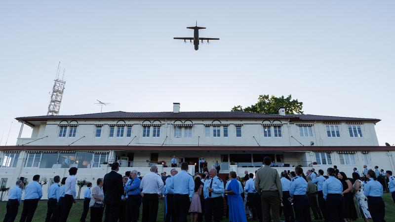A C-130J Hercules from 37 Squadron flies overhead the assembled guests and visitors at RAAF Base Glenbrook during the 75th anniversary celebrations.