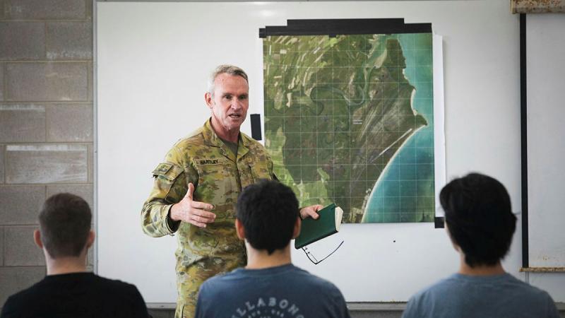 Warrant Officer Class 1 Jason Hartley from 17th Sustainment Brigade gives a brief about Exercise Overland Nautical Petros and the petroleum operator trade to potential recruits at Crowley Beach Training Area, Queensland. 